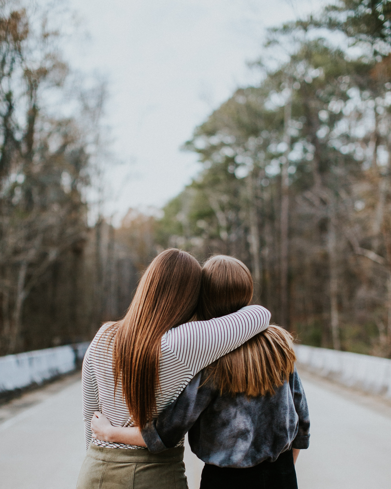 women side hugging - feeling less vulnerable