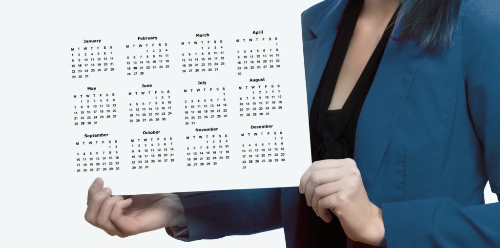 business woman holding monthly calendar