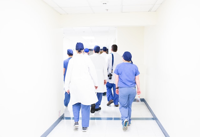 healthcare leaders walking to surgery area at hospital